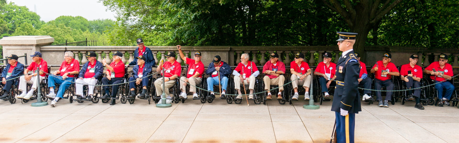 Honor Flight veterans watching at Tomb of the Unknown Soldier